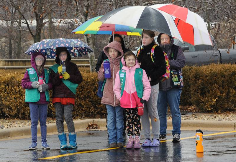 Despite the rainy weather , many turned out Saturday at the Middle East Conflicts Wall in Marseilles  for the Wreaths Across America ceremony which was one of over 4,000 such events took place across the country honoring veterans.