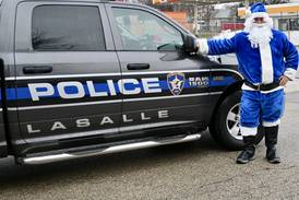 La Salle police deliver gifts to more than 150 children with its Officer Santa Program 